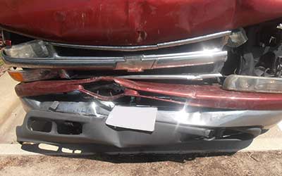 Damage to front of red truck